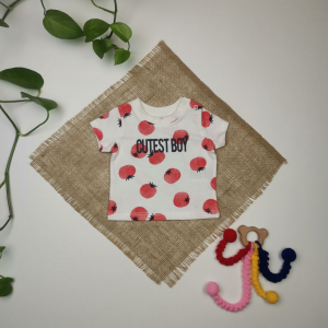 تیشرت نوزادی دخترانه آستین کوتاه برند lupilu طرح گوجه دکمه دار سفید رنگ